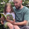 Connecting with nature parent and child reading the butterfly nature discovery book