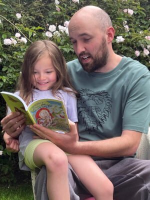 Connecting with nature parent and child reading the butterfly nature discovery book